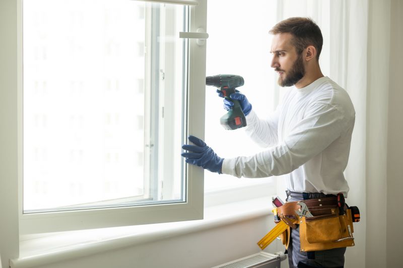 Technicians working on a window frame